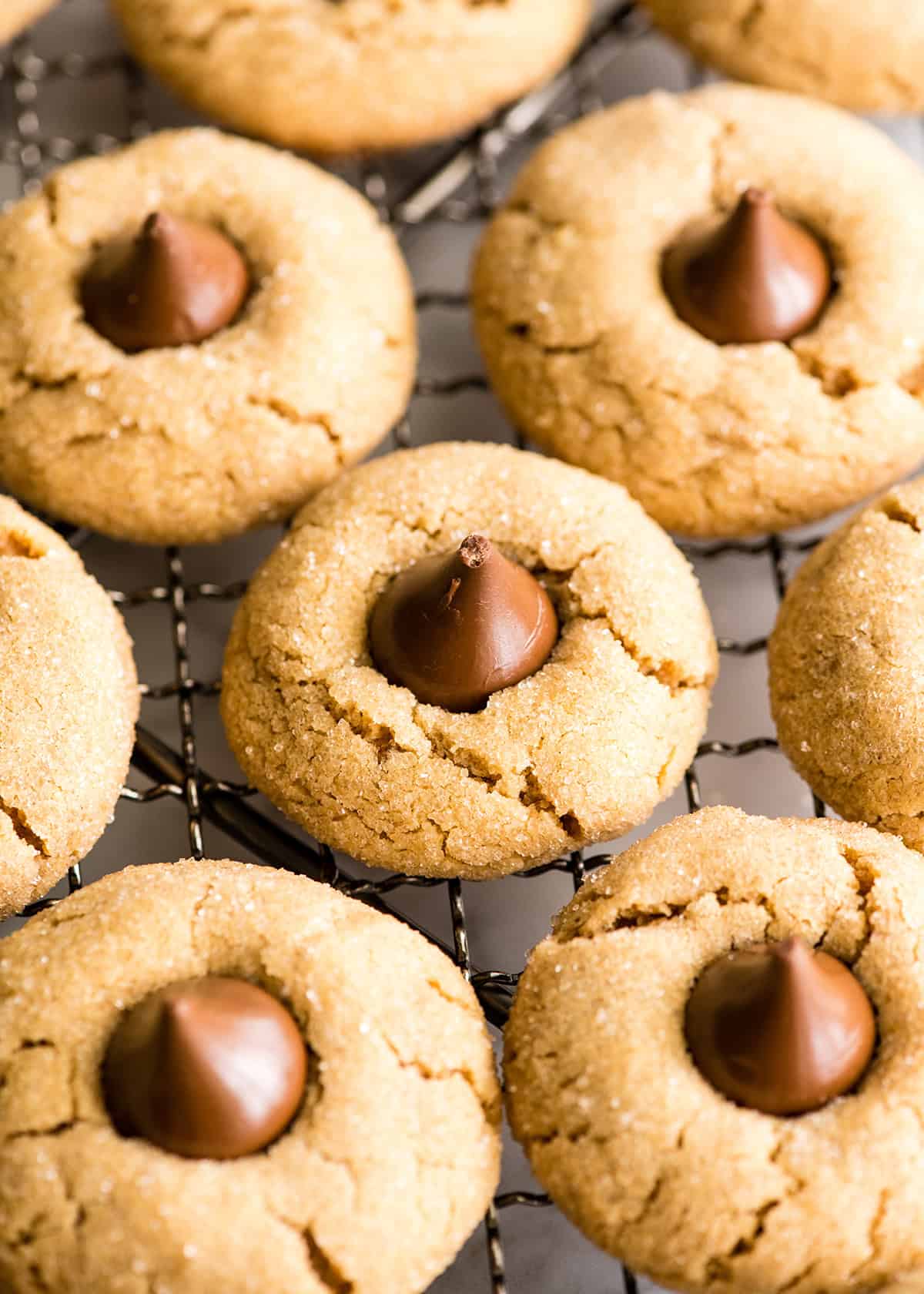 7 peanut butter blossoms on a metal wire cooling rack
