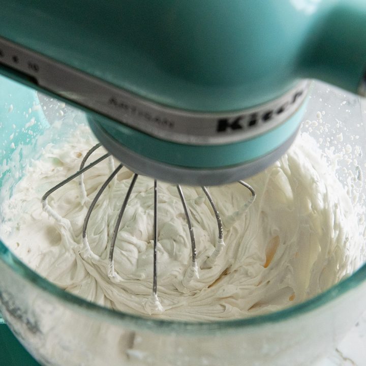 How to Make Whipped Cream - stiff peaks formed in a standing mixer fitted with the wire whisk attachment