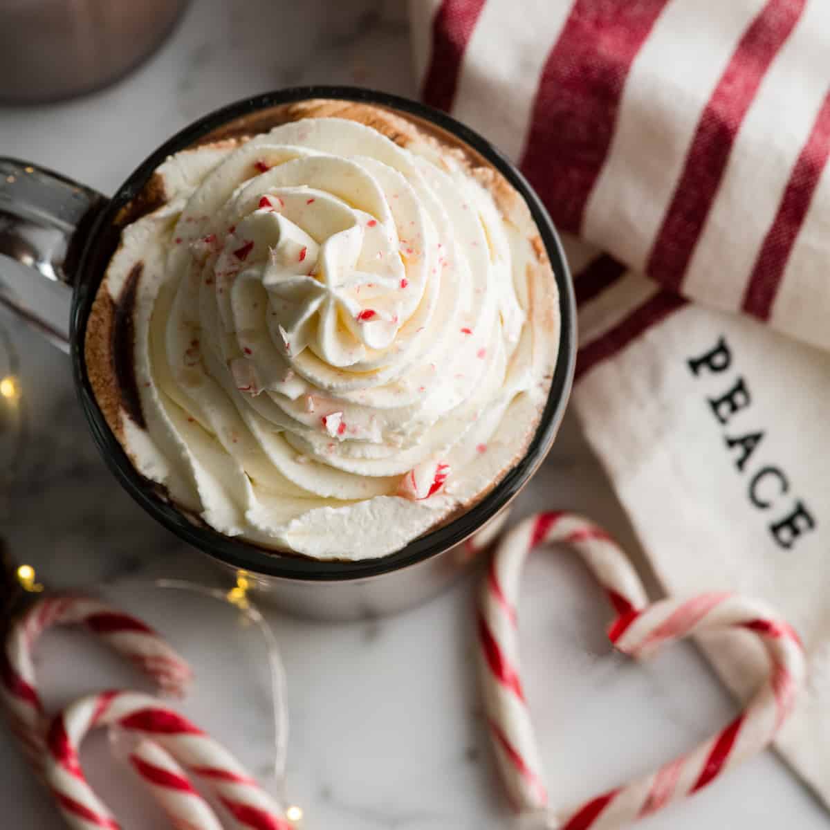 overhead view of peppermint hot chocolate with whipped cream