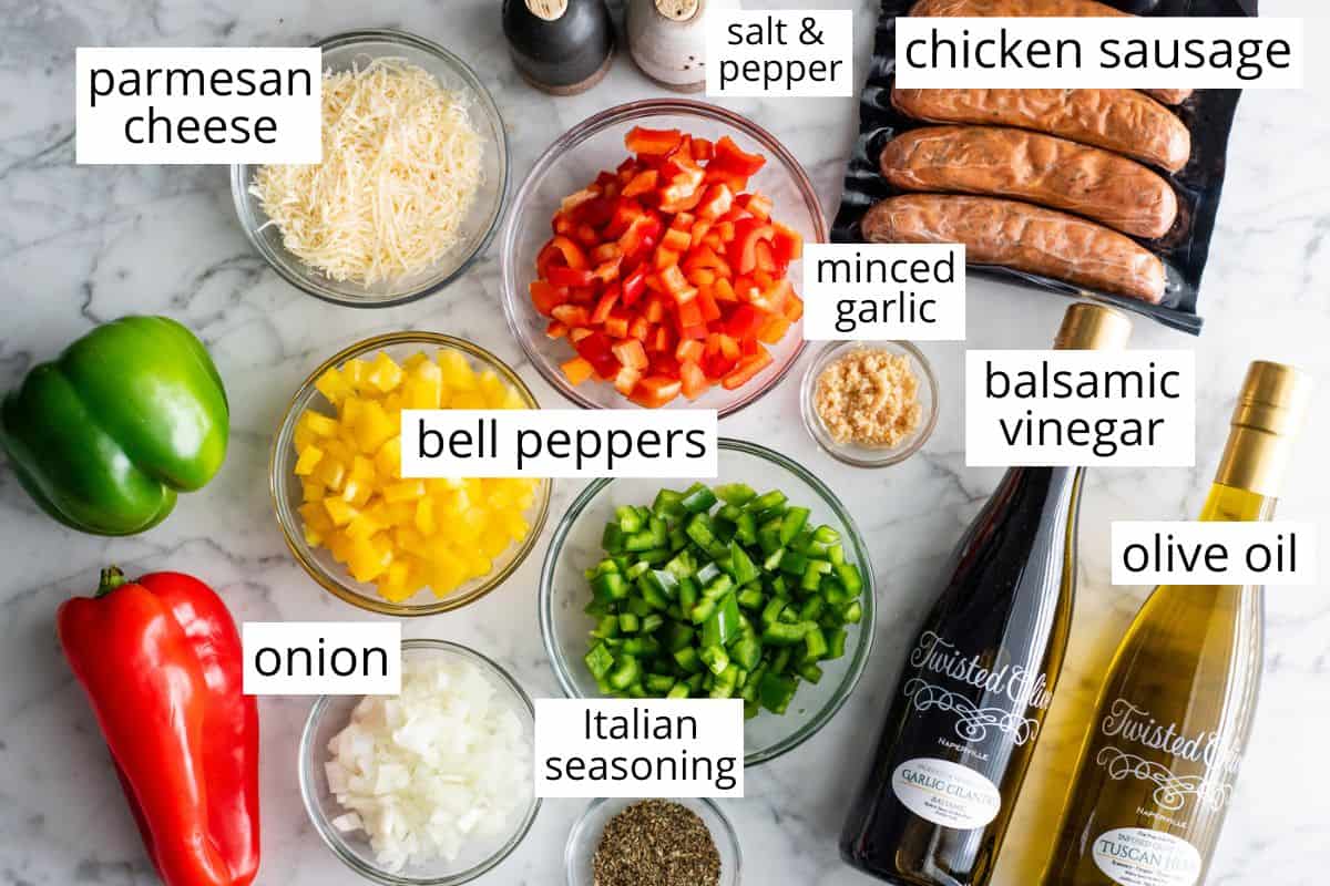 overhead view of the labeled ingredients in this chicken sausage and peppers recipe