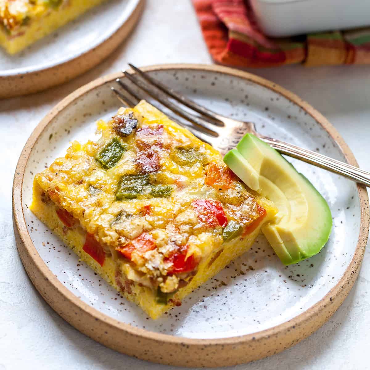 front view of a piece of egg casserole on a plate