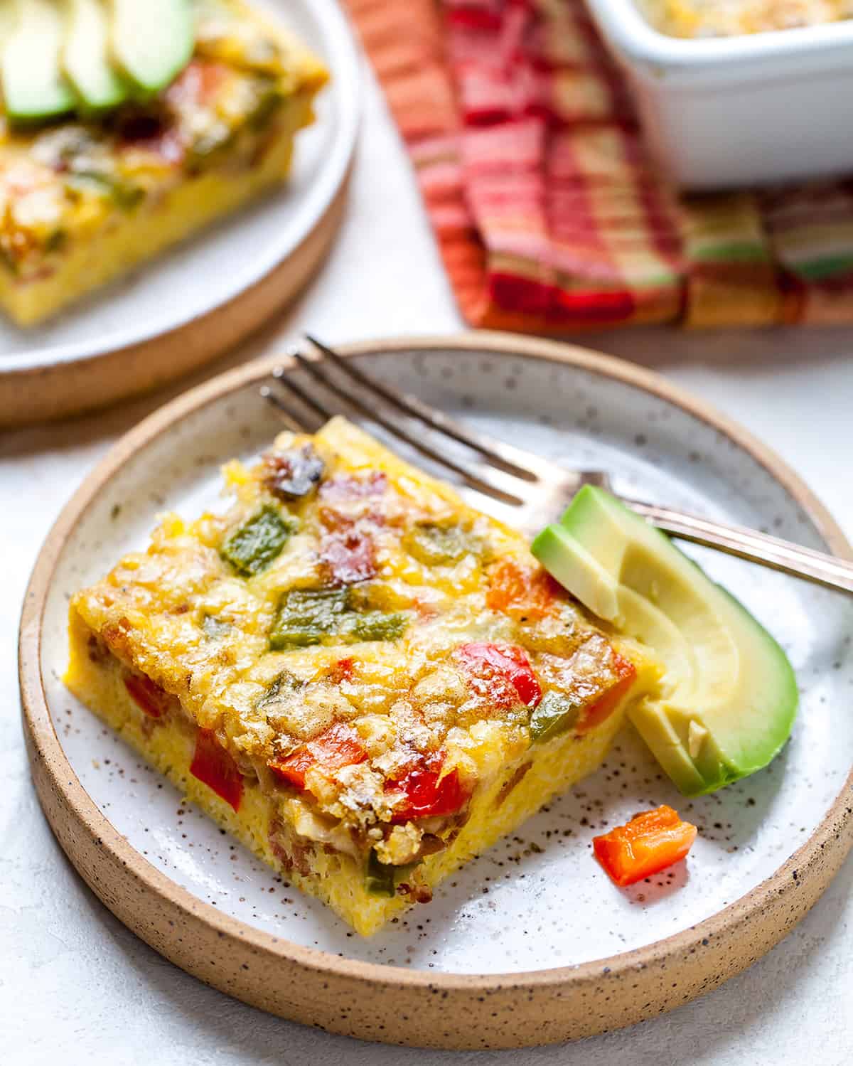 front view of a piece of egg casserole on a plate