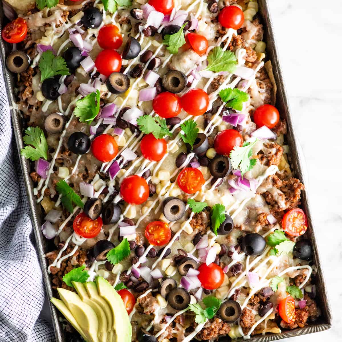 overhead photo of the best nachos recipe with nacho toppings