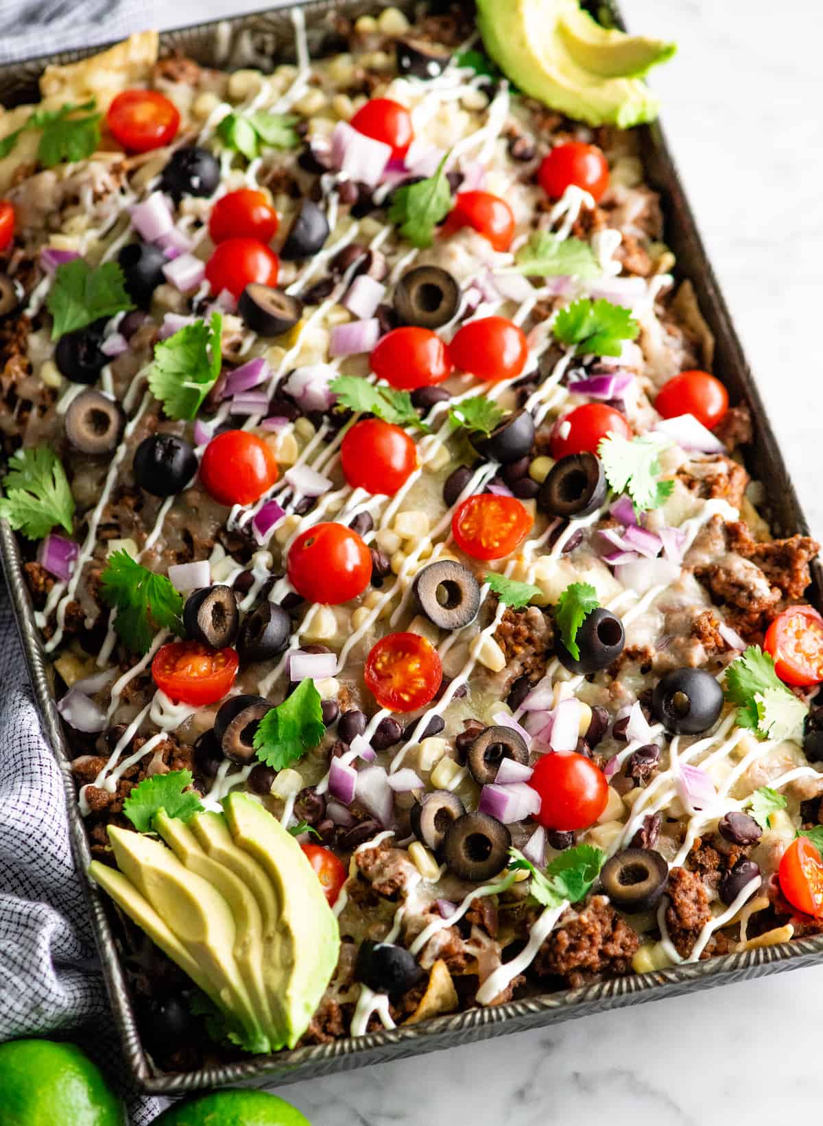 up close overhead view of nachos recipe with nacho toppings