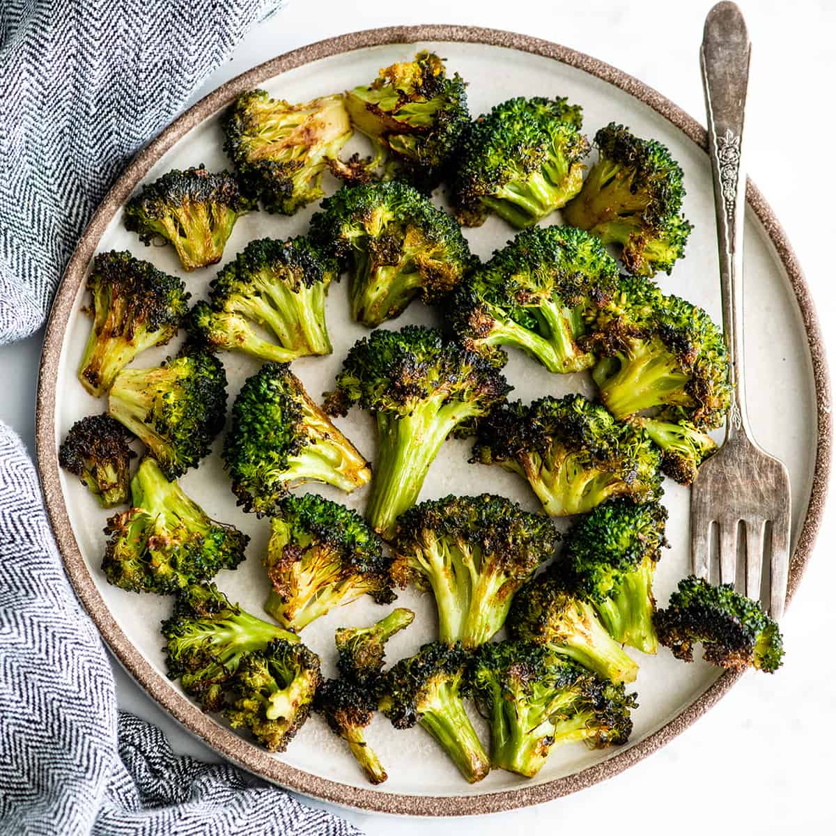 overhead view of roasted broccoli on a plate