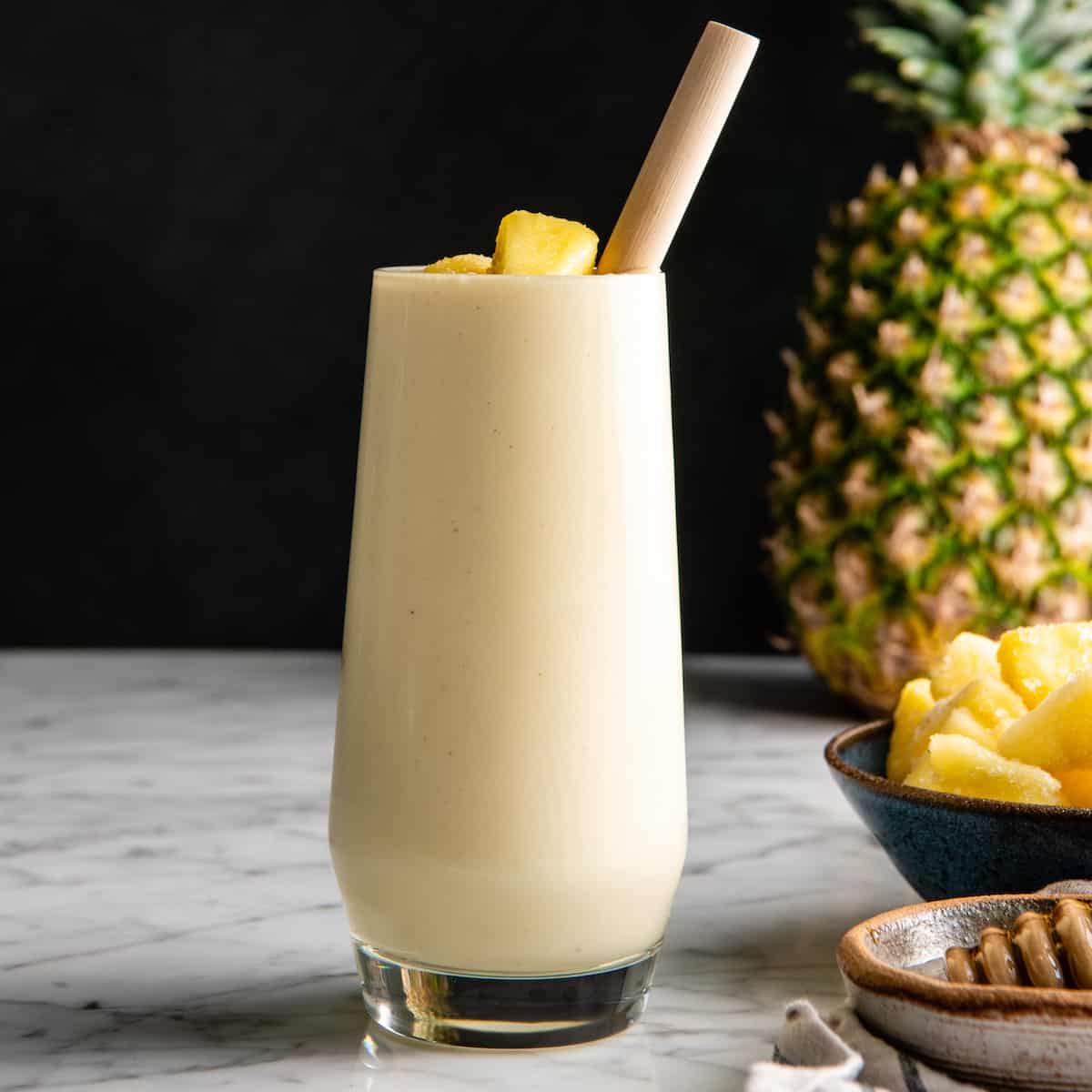 front view of a pineapple smoothie in a glass