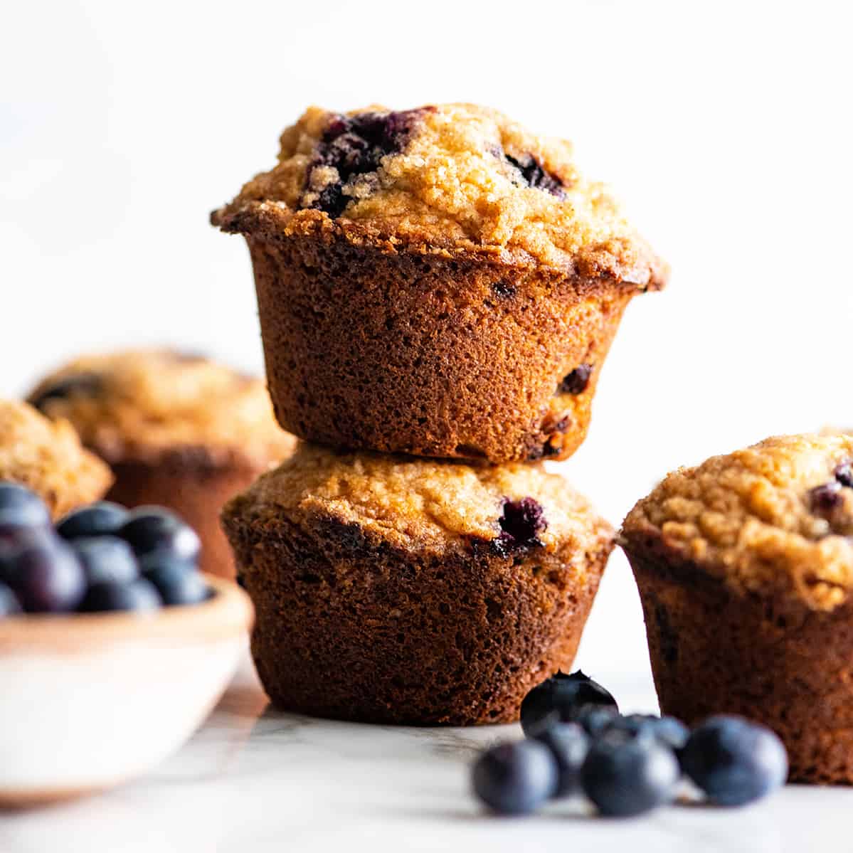 front view of two blueberry muffins stacked on each other
