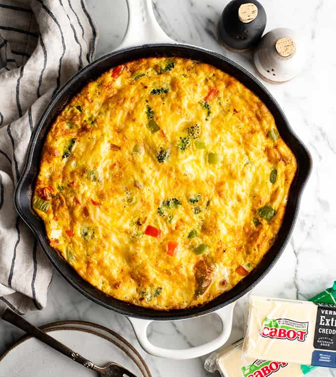 overhead view of a baked frittata in a cast iron skillet