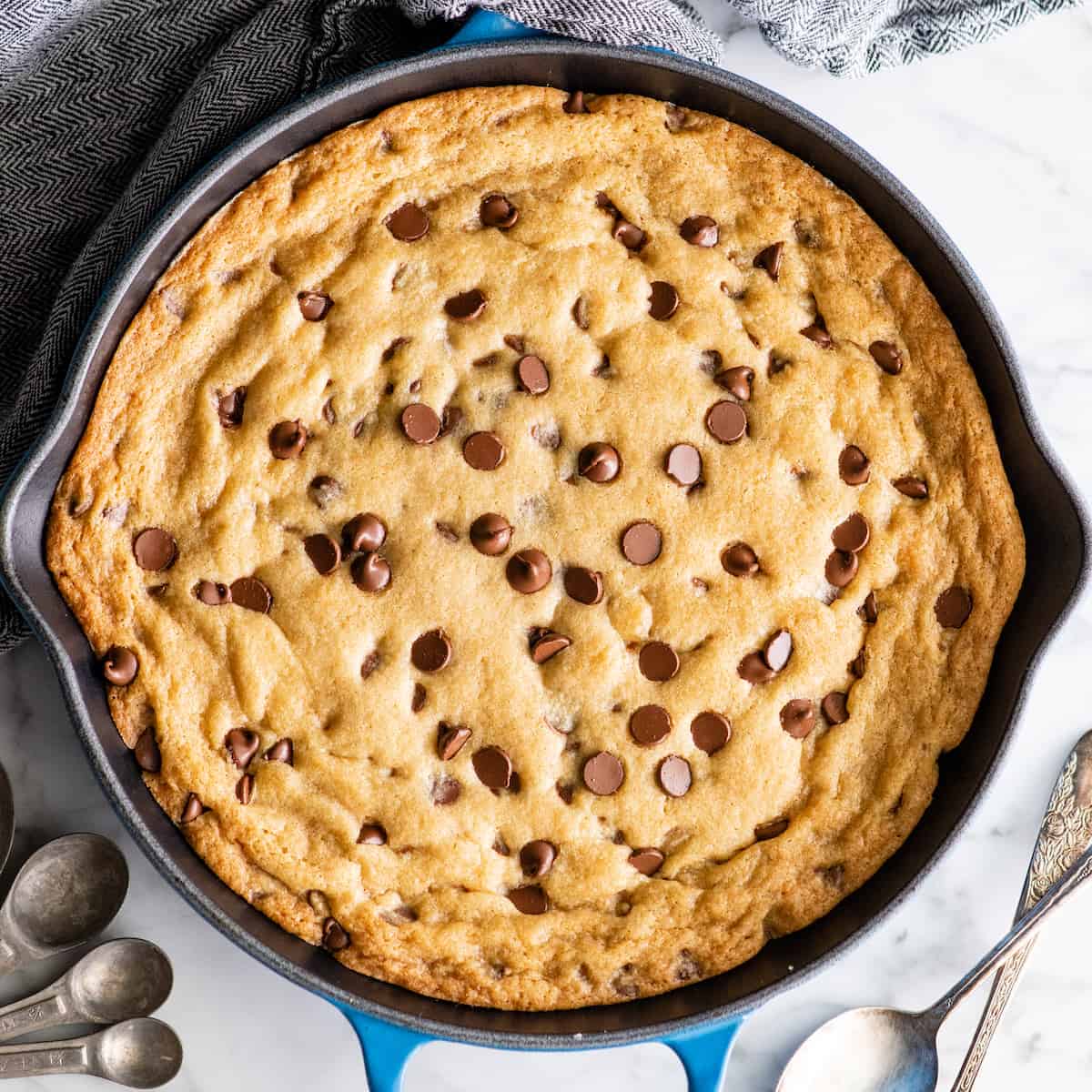 overhead view of a baked chocolate chip skillet cookie