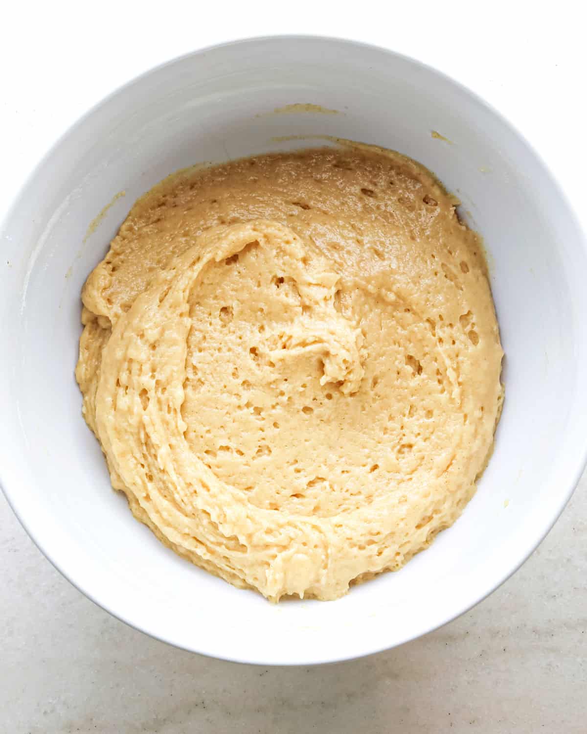 blueberry muffin batter in a white bowl