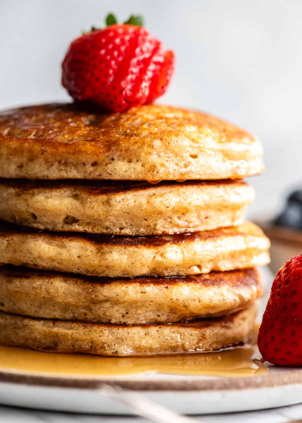 front view of a stack fo 5 whole wheat pancakes