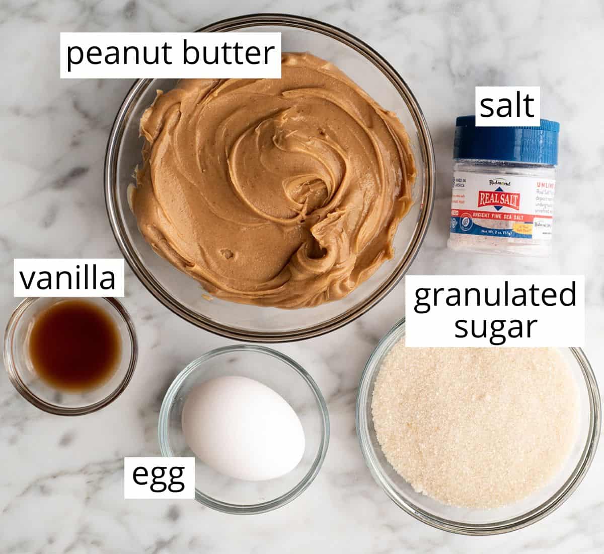overhead view of the labeled ingredients in this flourless peanut butter cookie recipe