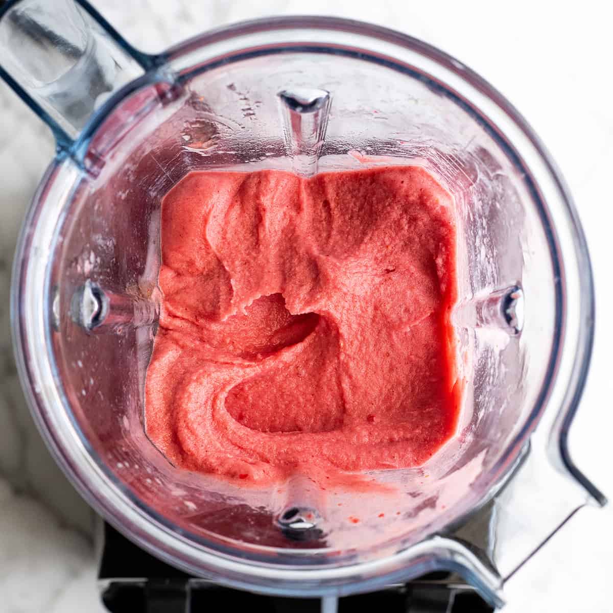 overhead photo showing how to make a smoothie bowl in a Vitamix blender