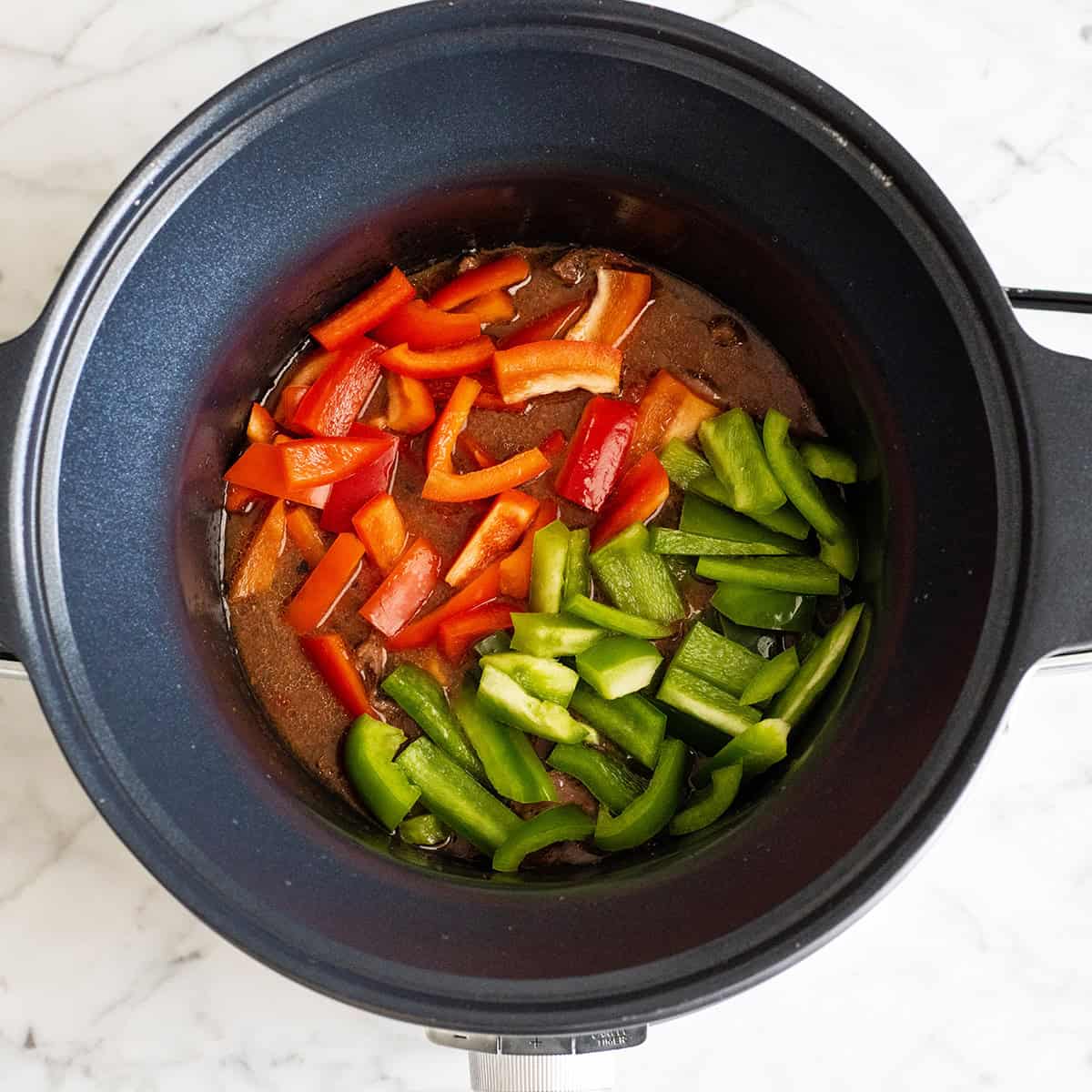 peppers added to the cooked peppers steak in the crock pot 