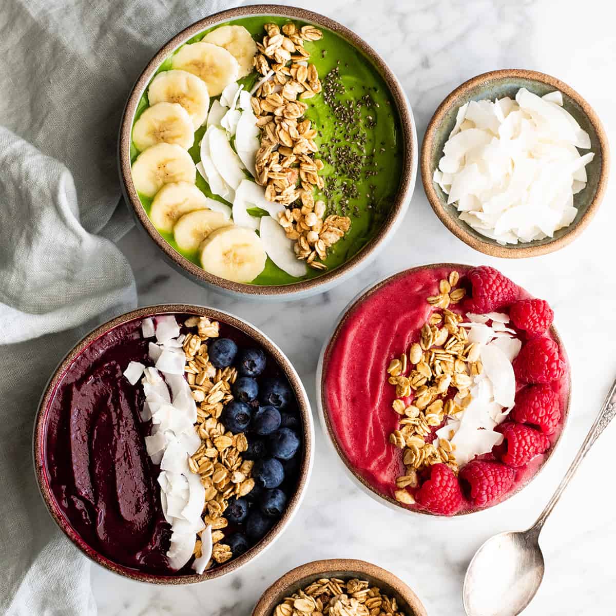 overhead photo of 3 smoothie bowls