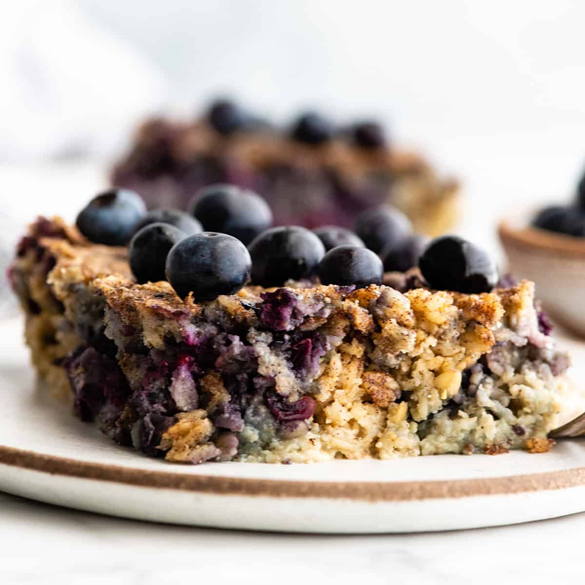 front view of a piece of Blueberry Baked Oatmeal on a plate