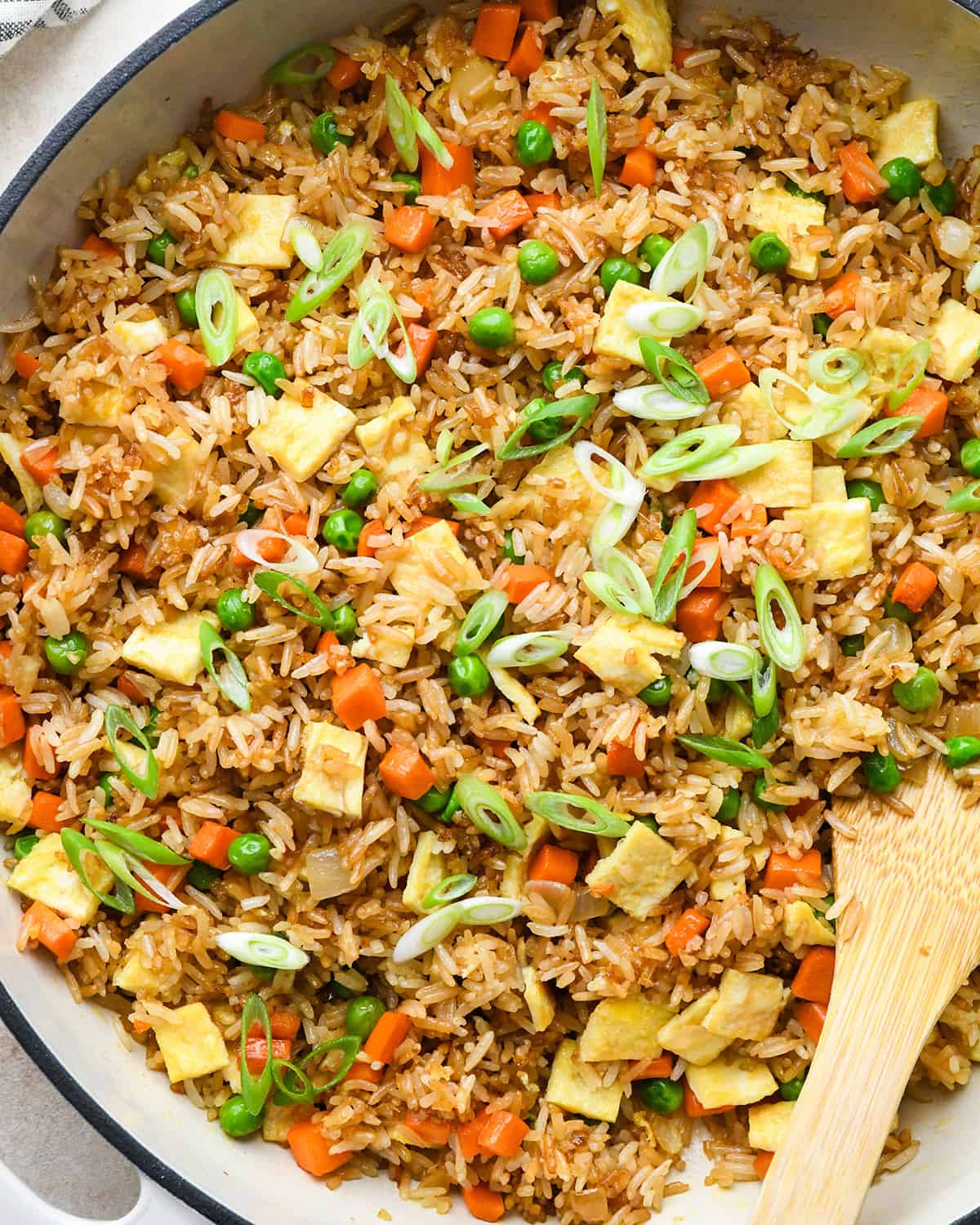 Best Fried Rice Recipe in a pan with a wooden spoon