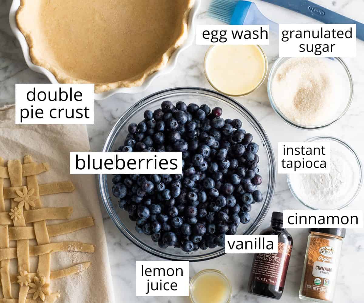 overhead view of the labeled ingredients in this blueberry pie recipe