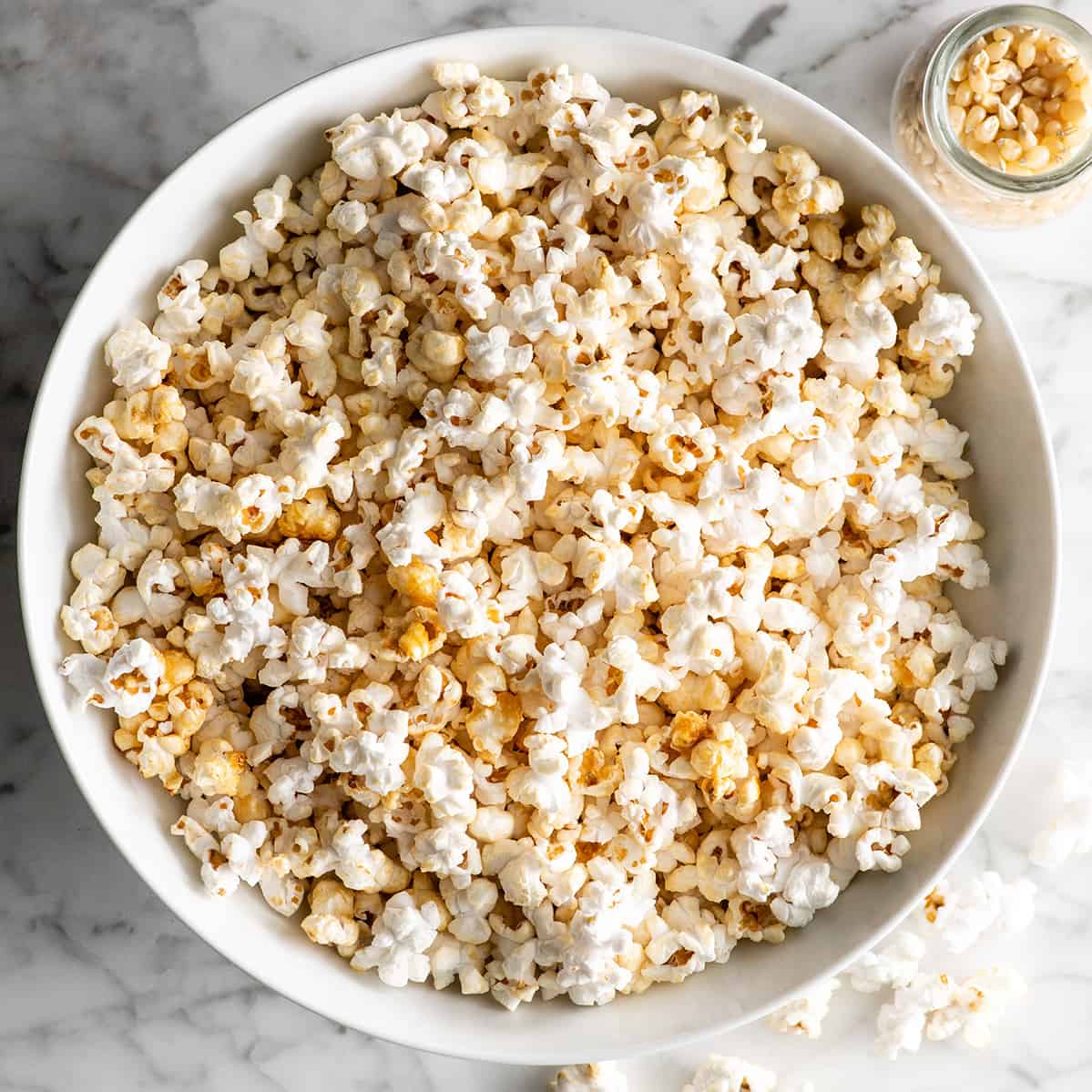 overhead view of a large white bowl of kettle corn