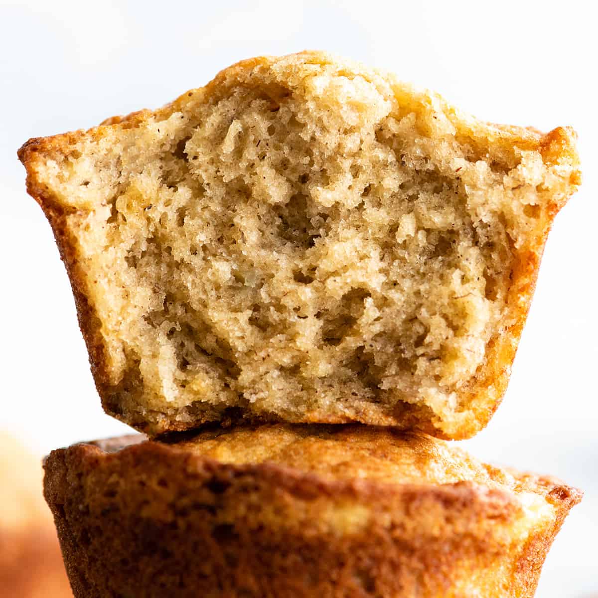 up close view of the inside of a banana muffin cut in half