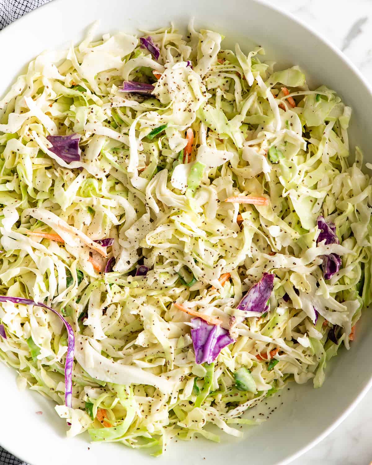 up close photo of homemade coleslaw in a bowl
