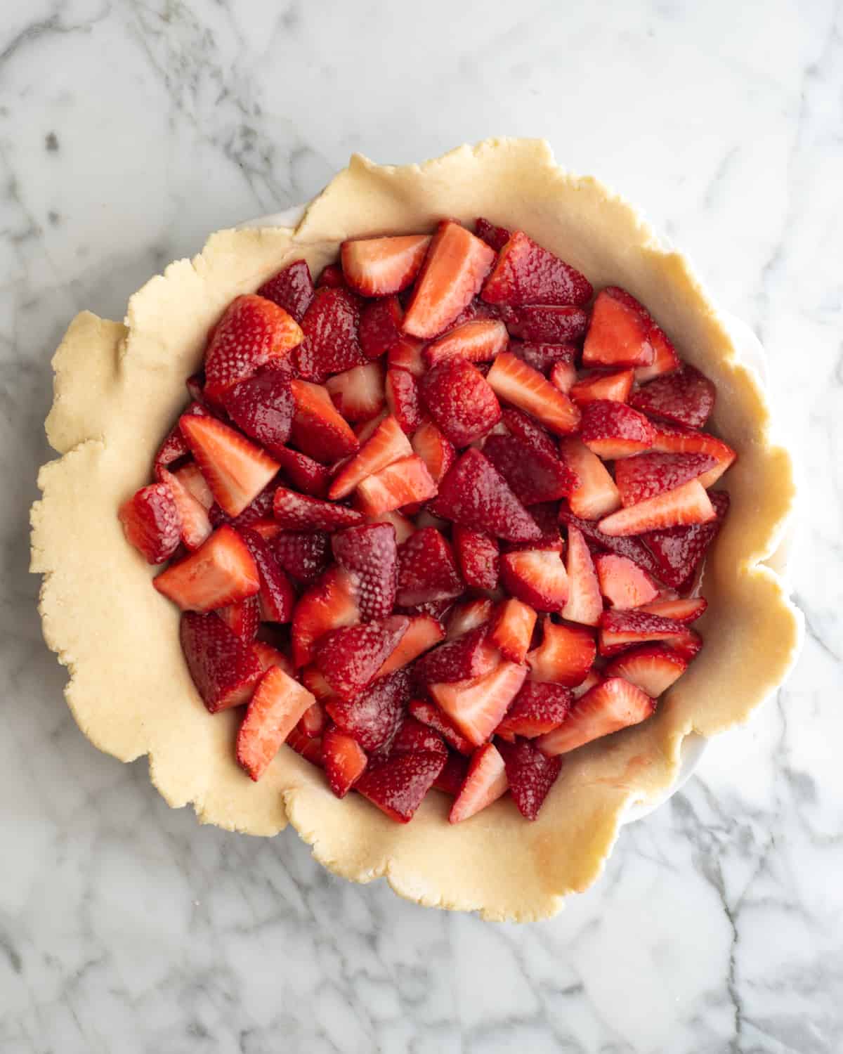 strawberry filling put into a bottom pie crust 