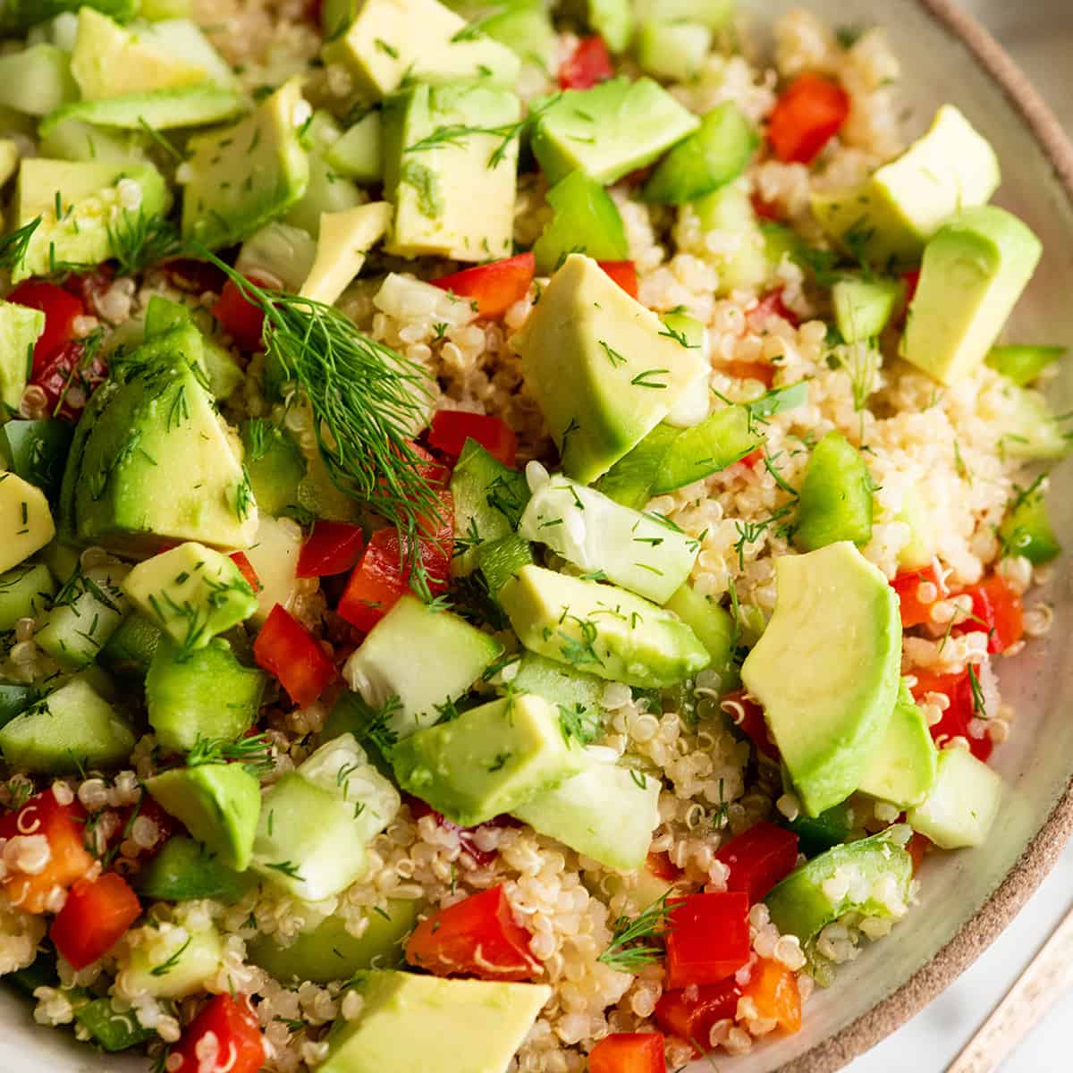 up close view of a large bowl of quinoa salad