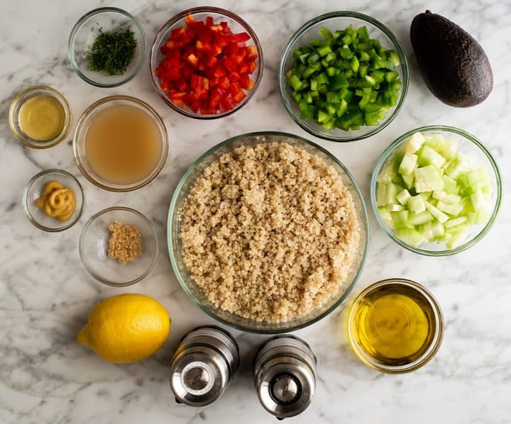 This easy Quinoa Salad Recipe is fresh and delicious! Quinoa, veggies, avocado & dill are tossed in a homemade lemon vinaigrette for a nutritious summer salad! It's a vegan, paleo & gluten-free salad that's perfect for BBQs & potlucks! photo of the ingredients in this quinoa salad