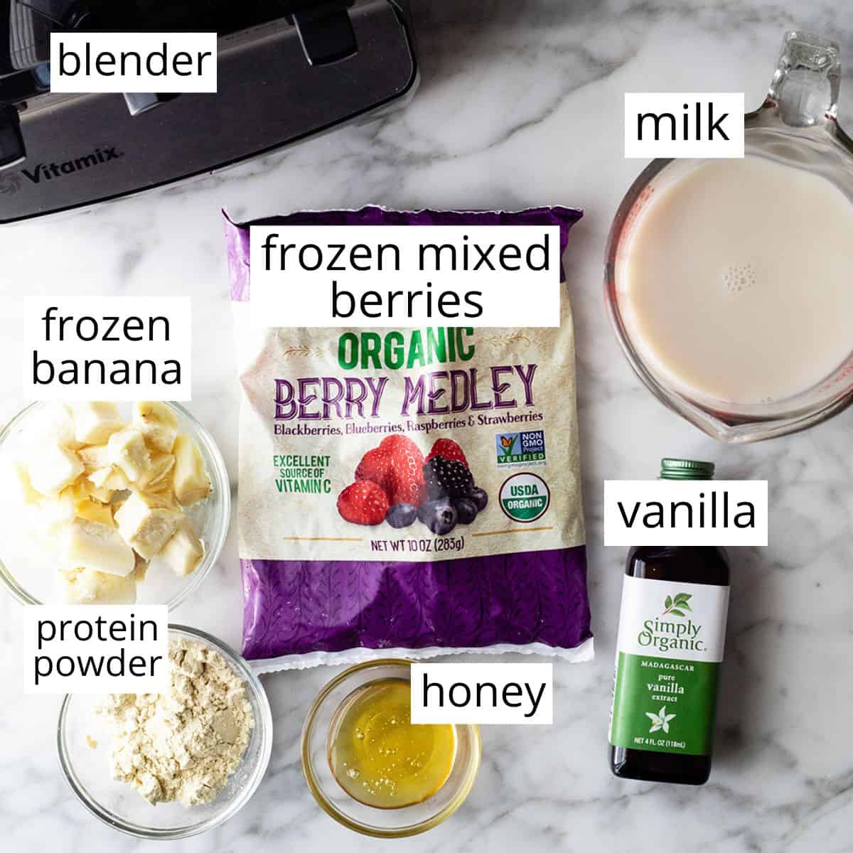 overhead view of the labeled ingredients in this berry smoothie recipe