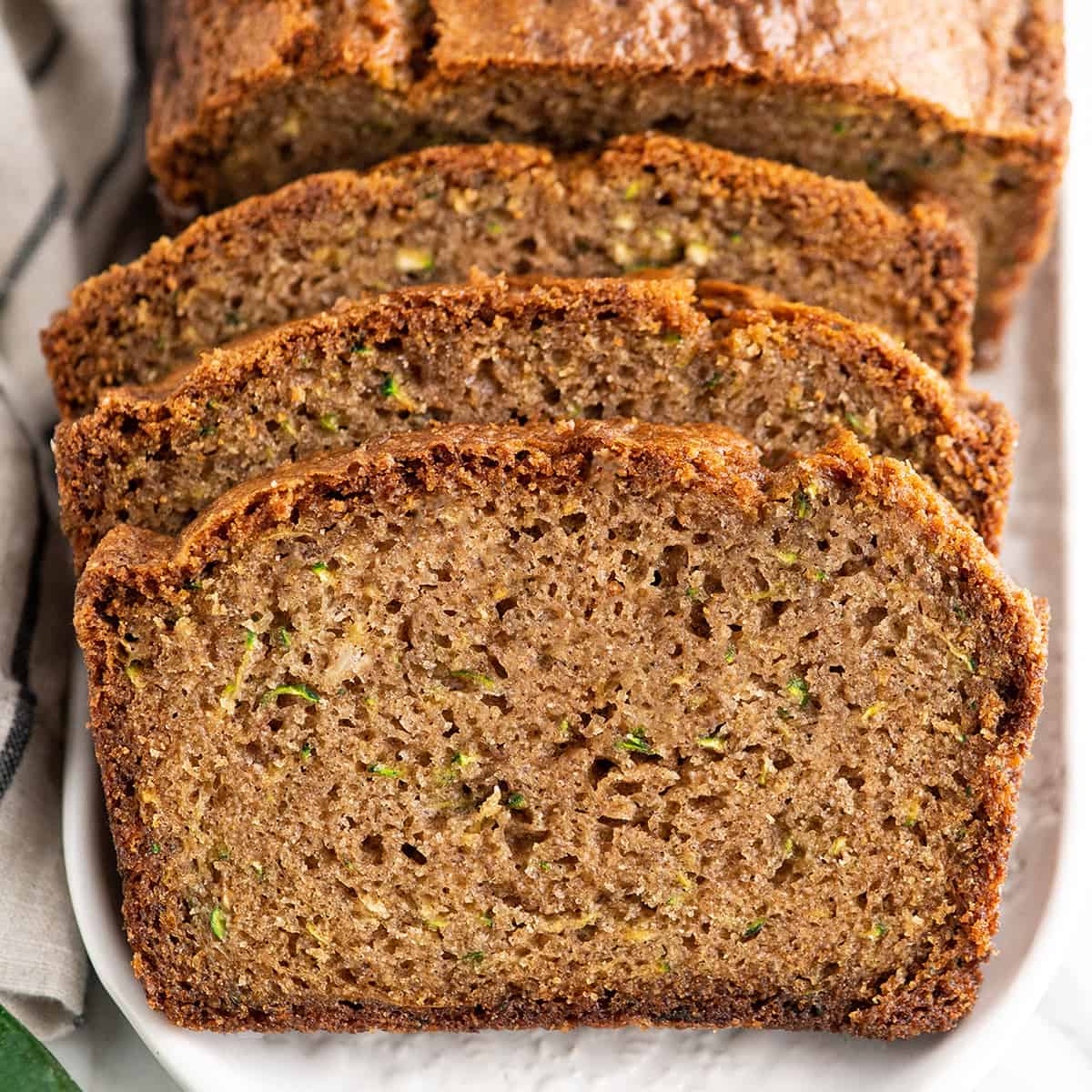 Front view of 3 slices of zucchini bread