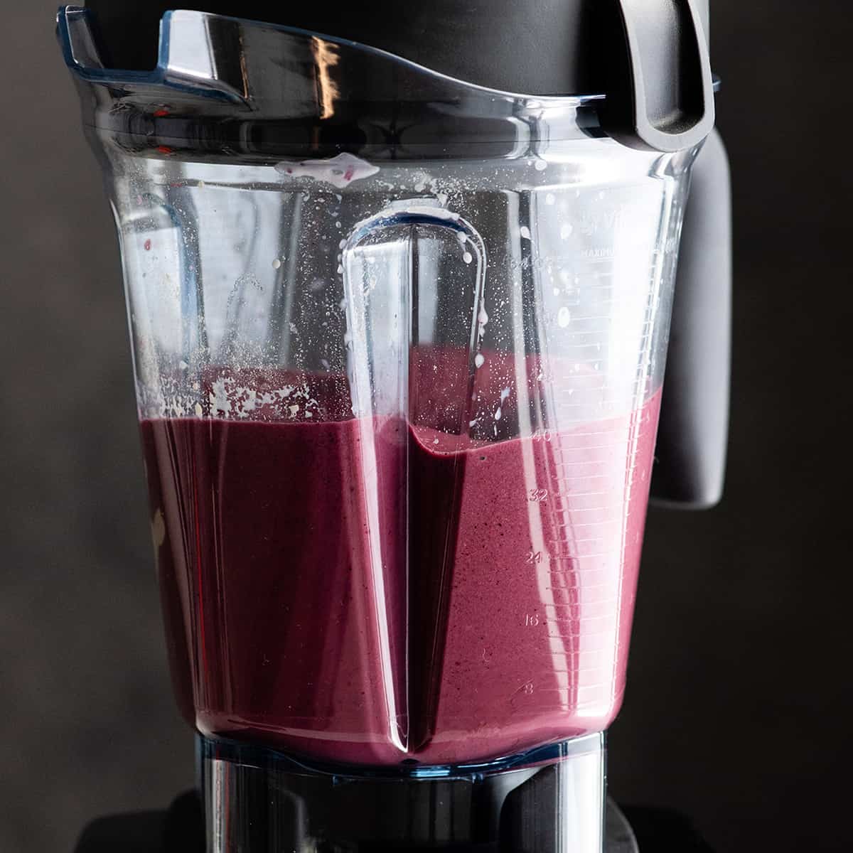 front view of a berry smoothie being blended in a Vitamix 