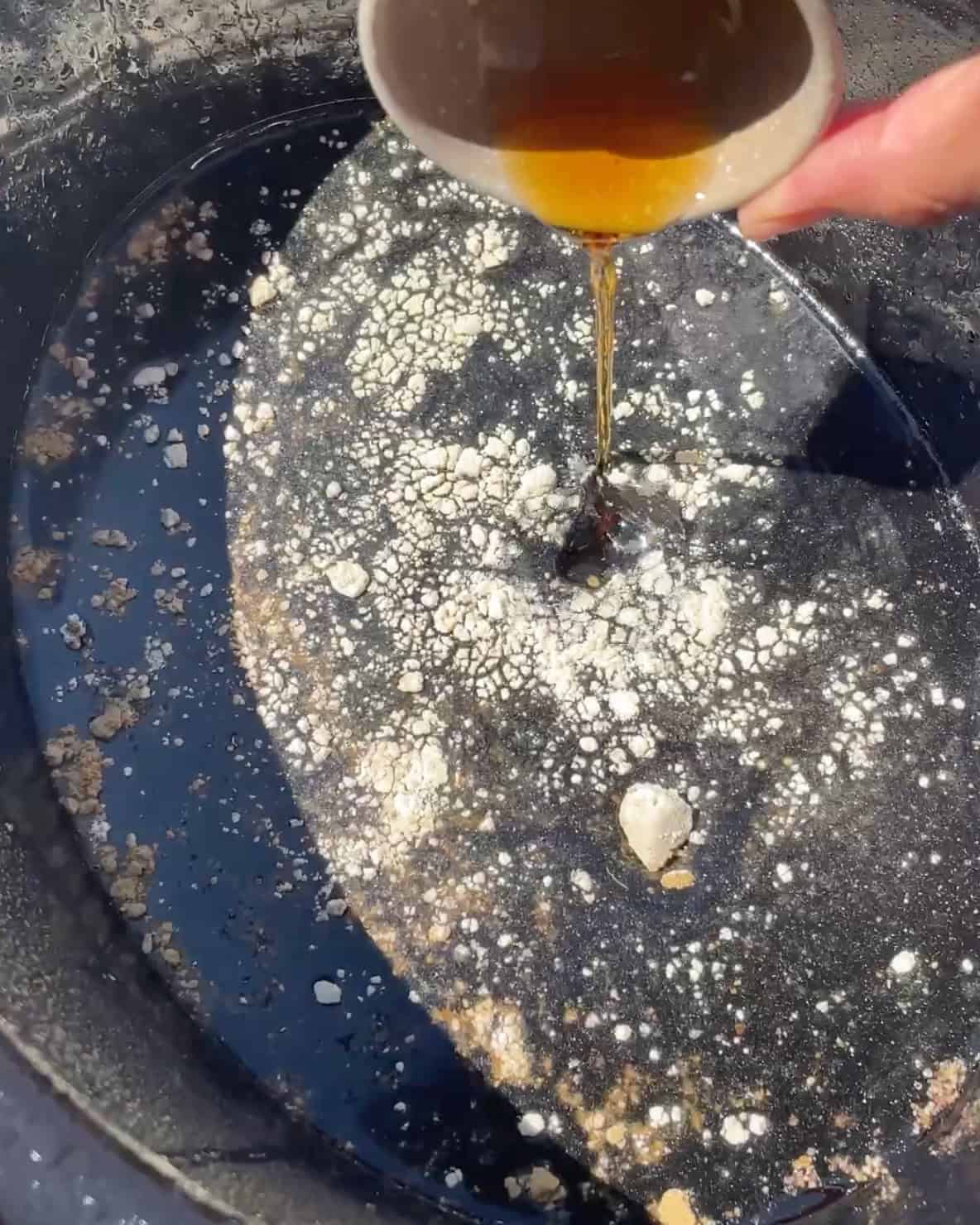 making slow cooker teriyaki chicken - adding sauce ingredients to the container of a crock pot