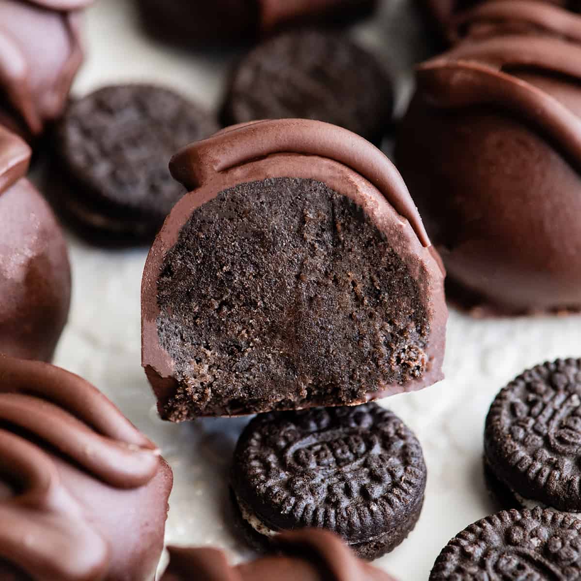 front view of an Oreo ball cut in half so the inside of is visible