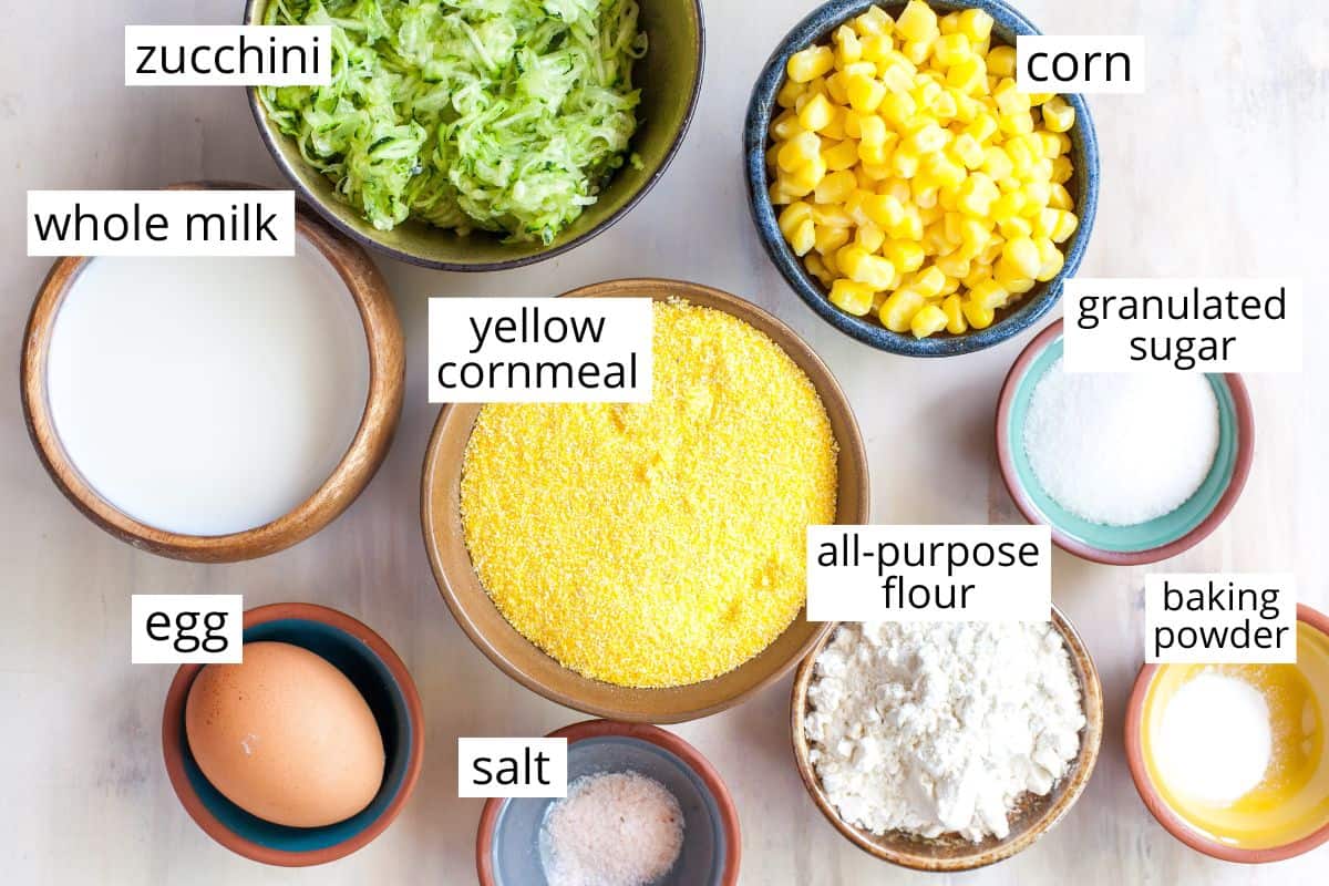 overhead view of the labeled ingredients in this baked zucchini fritters recipe