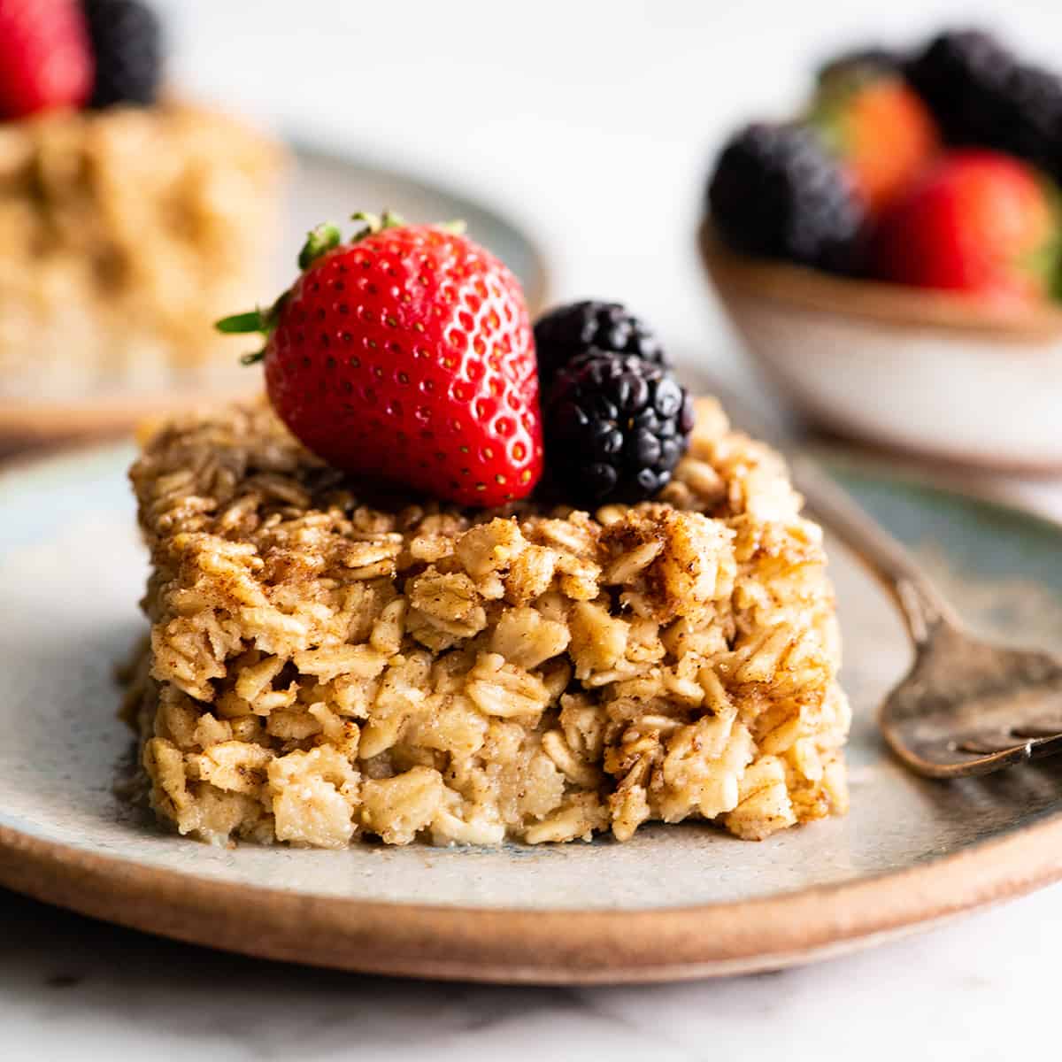 front view of a piece of baked oatmeal with berries 