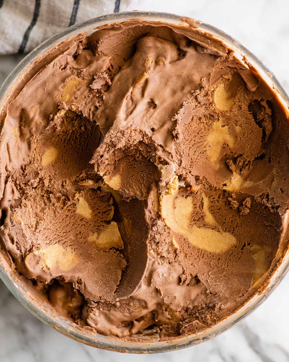 overhead photo of Homemade Chocolate Peanut Butter Ice Cream in a glass container