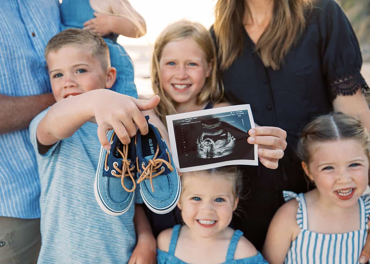 It's a boy! Pregnancy announcement photo and gender reveal with siblings. 