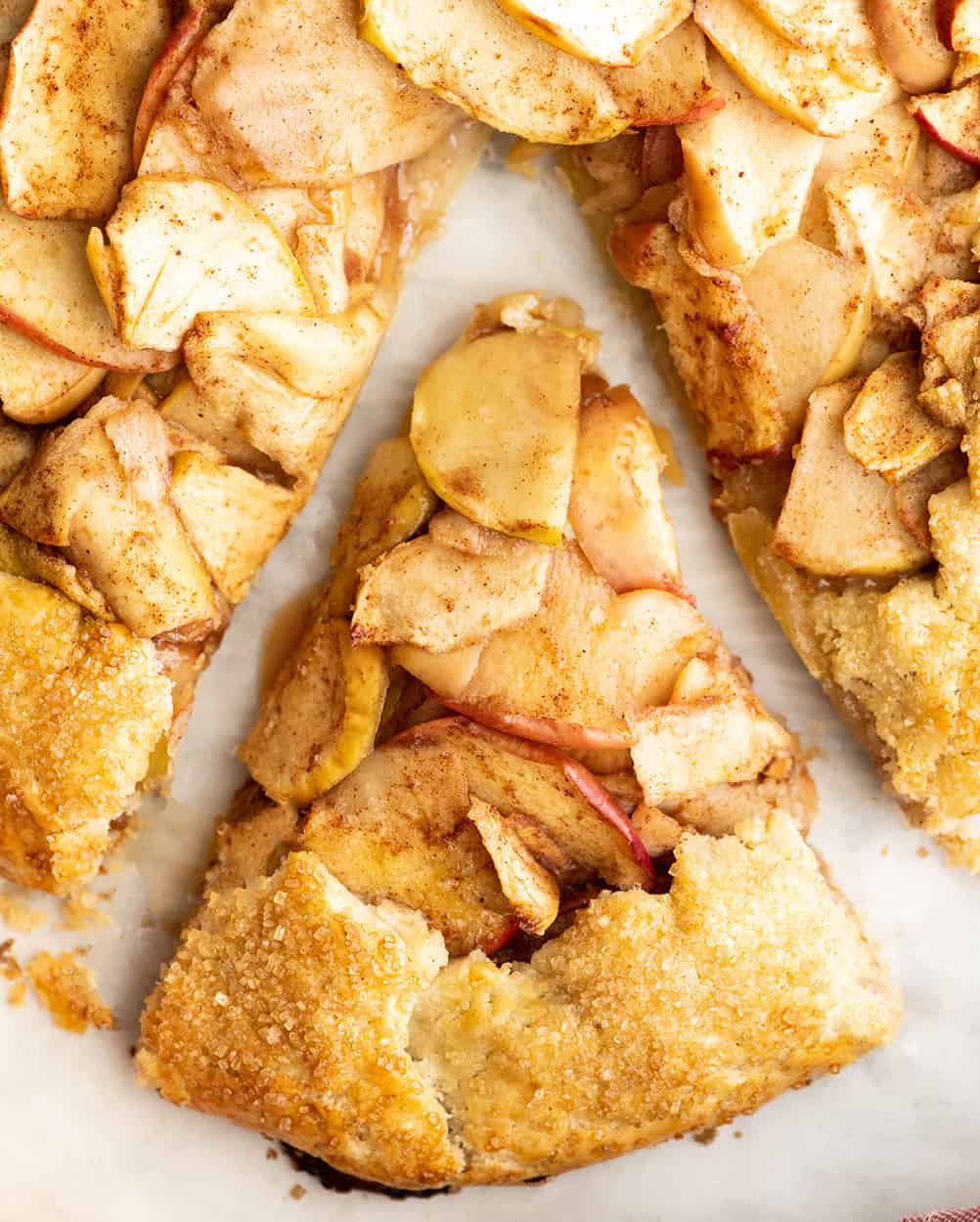 overhead view of a slice of apple galette cut into a triangle