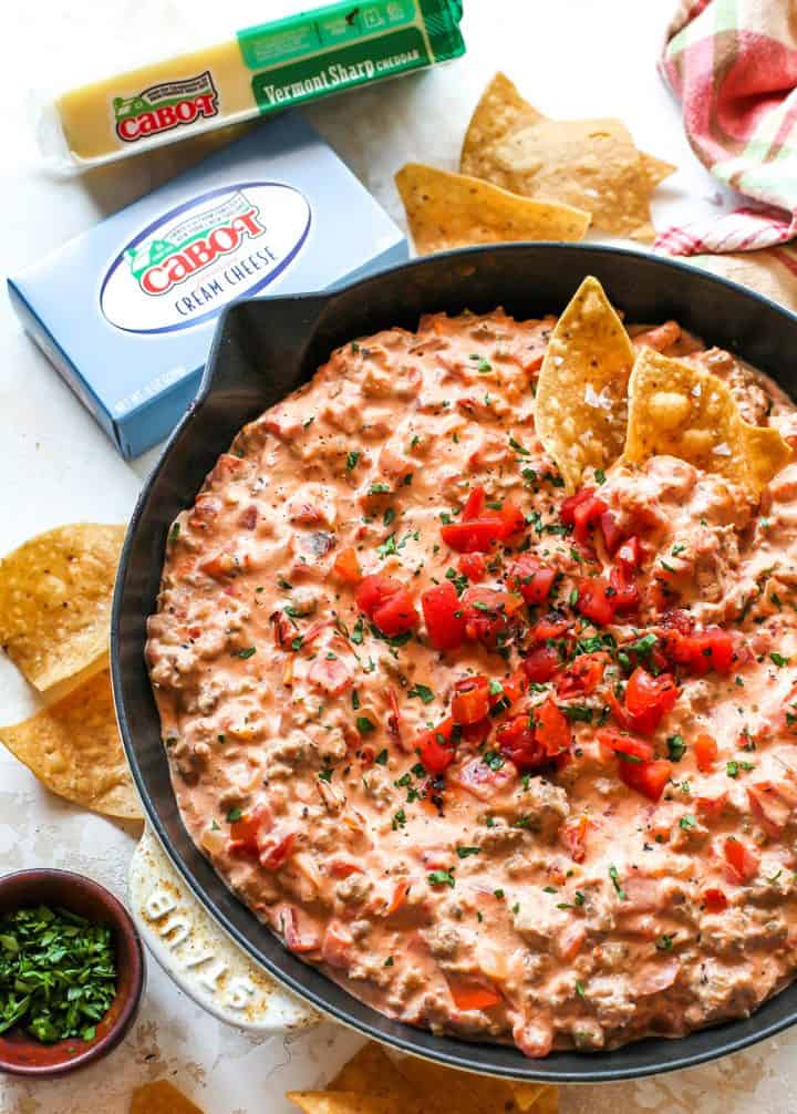 Cream Cheese Sausage Dip in a skillet with chips 