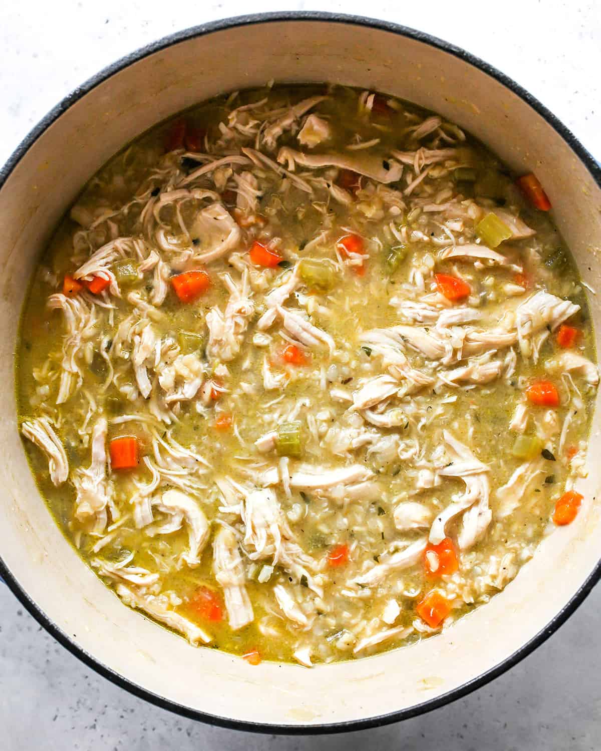 overhead view of chicken and rice soup in a pot
