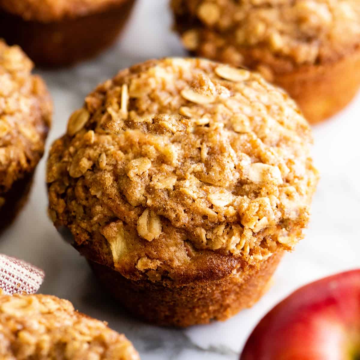 up close photo of a Cinnamon Apple Muffin with crumb topping