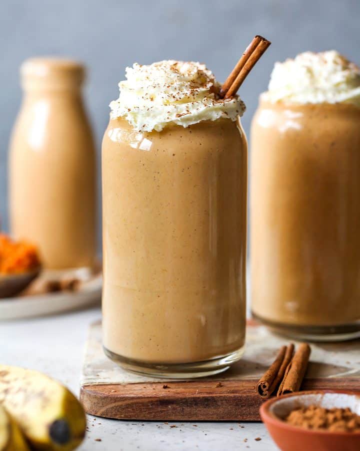 pumpkin pie smoothies in glasses with whipped cream