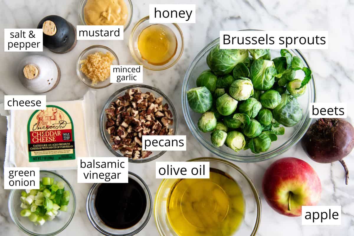 overhead photo of the labeled ingredients in this brussel sprout salad recipe