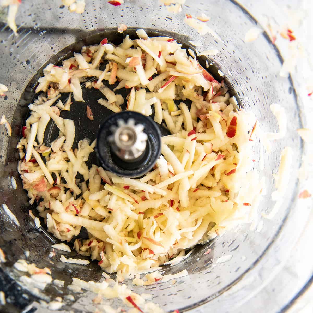 apples shred with the large shred disc in a Vitamix food processor