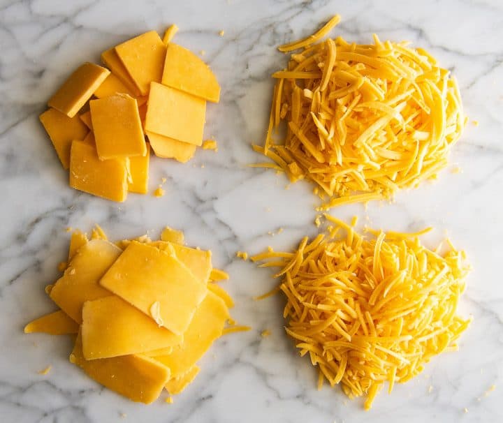 overhead view of cheese sliced and shredded 4 ways with the Vitamix food processor