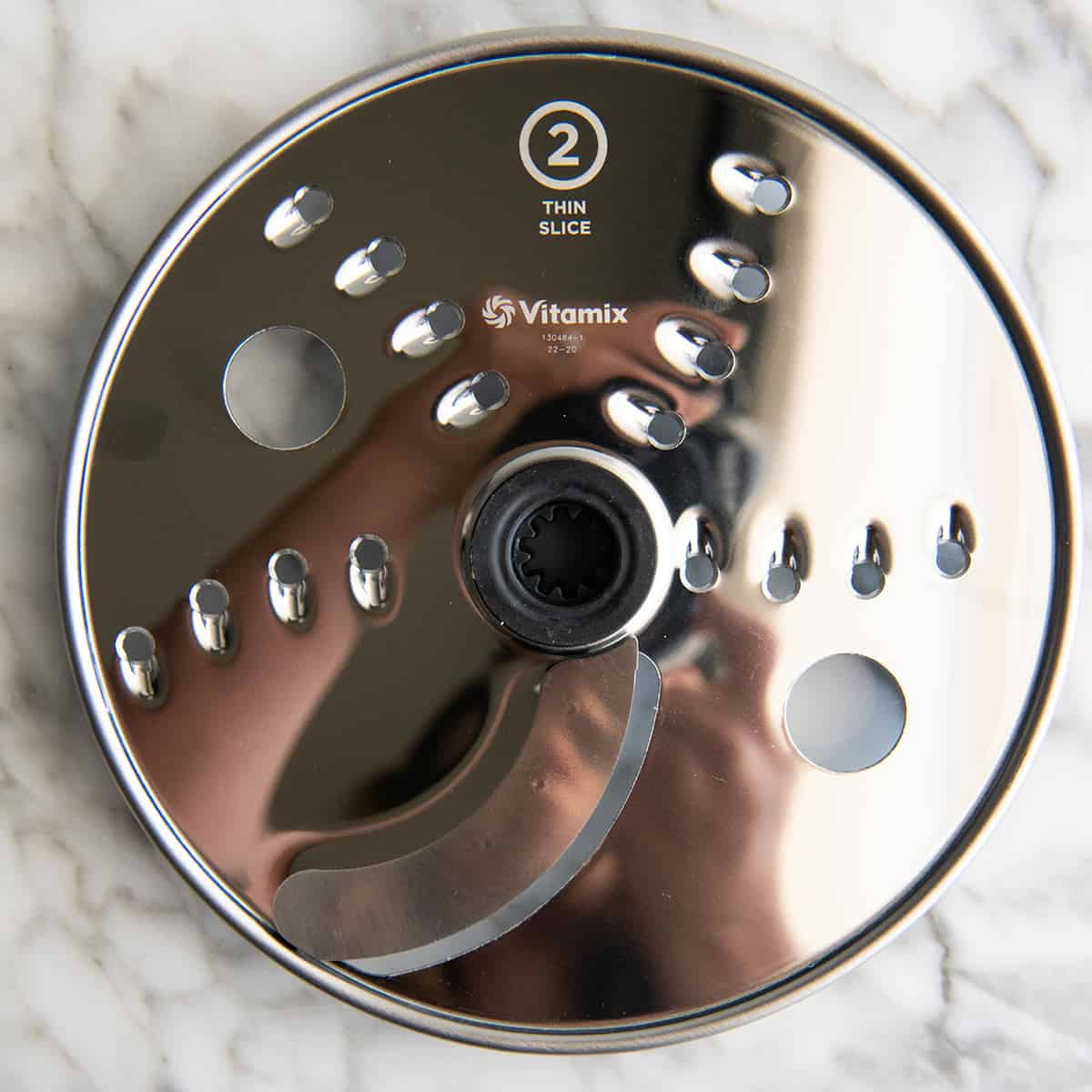 overhead photo of the thin slice disc for the Vitamix food processor