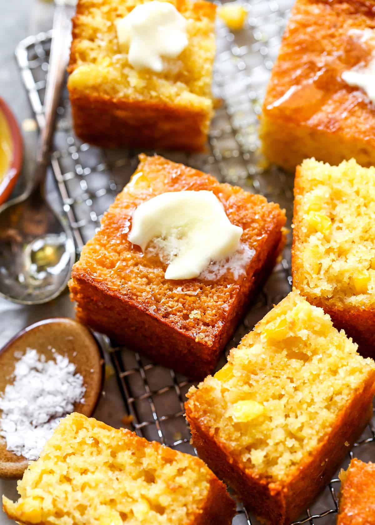 front view of slices of cornbread with butter
