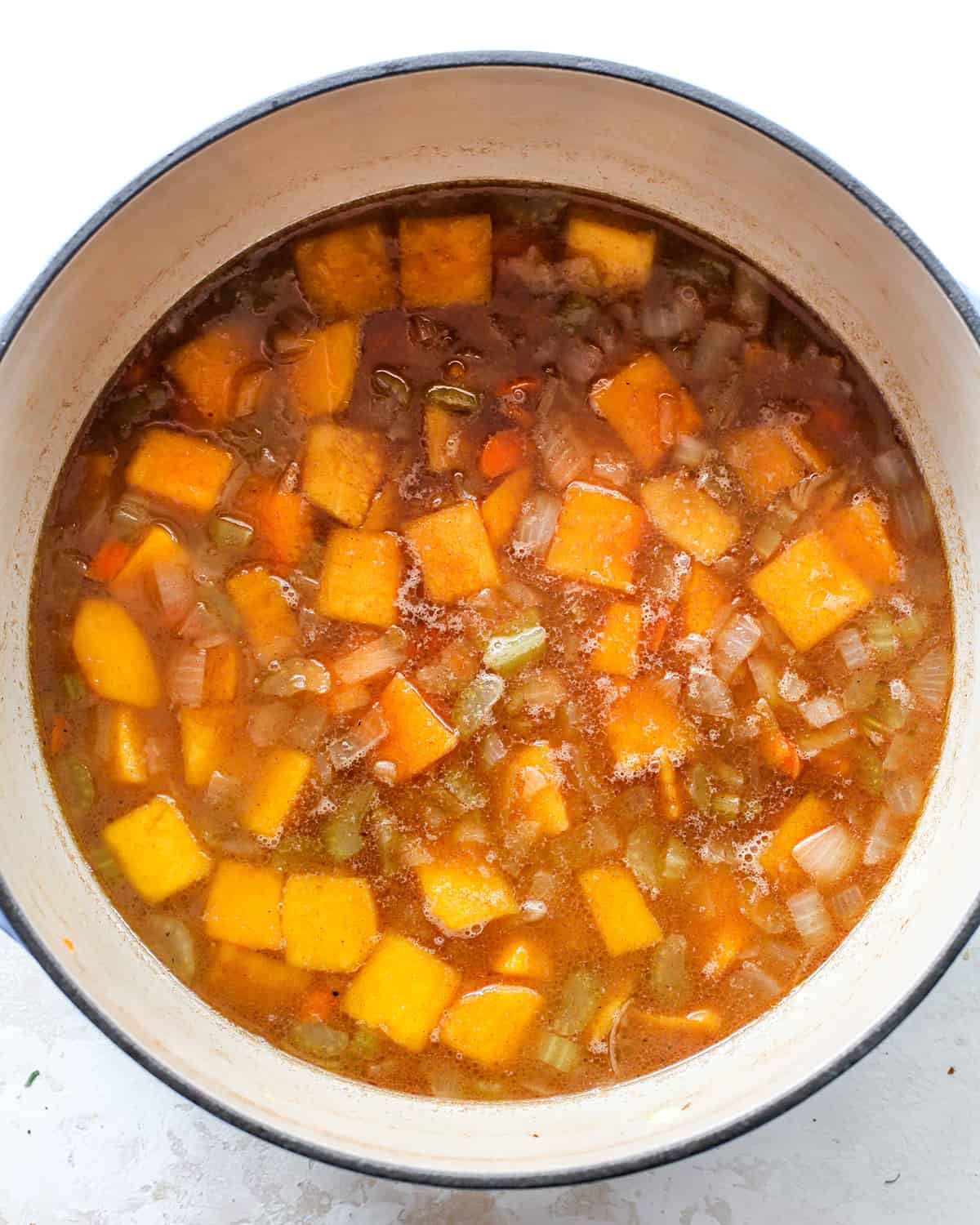 How to Make Butternut Squash Soup - simmering ingredients in a pot