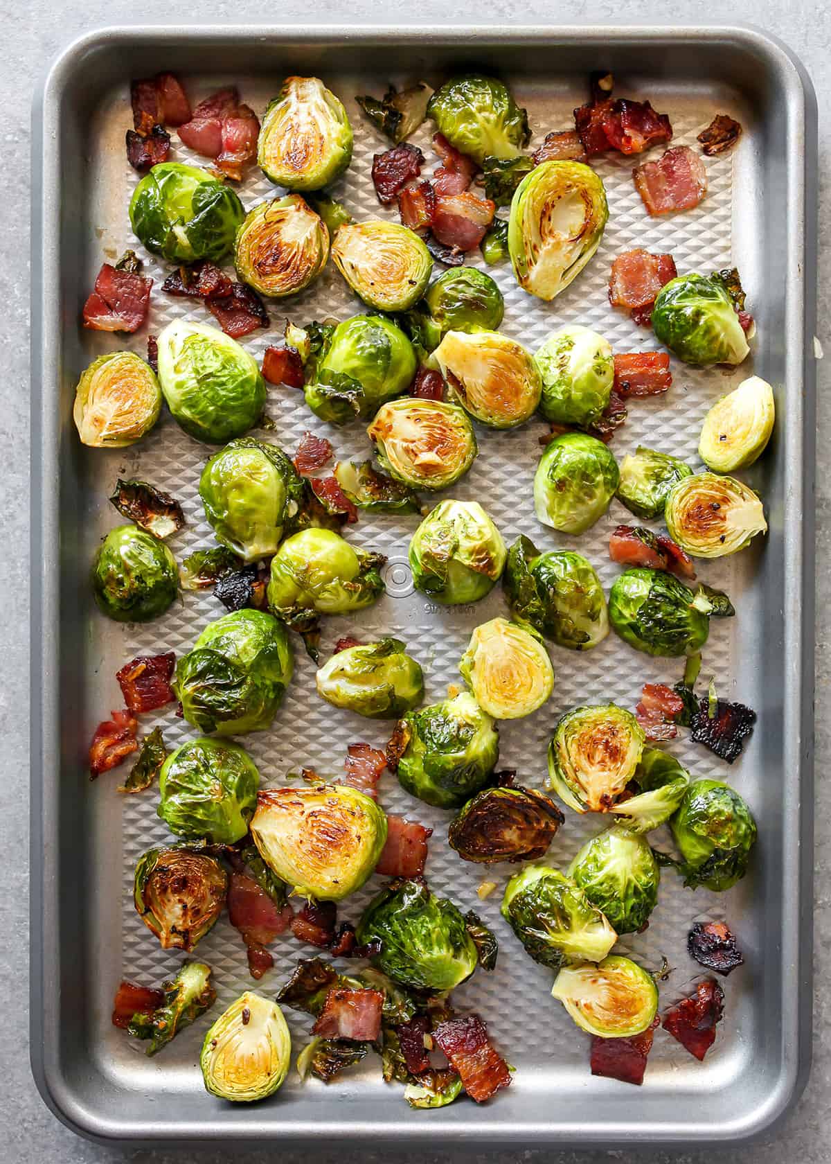 final roasted brussel sprouts with bacon on a baking sheet