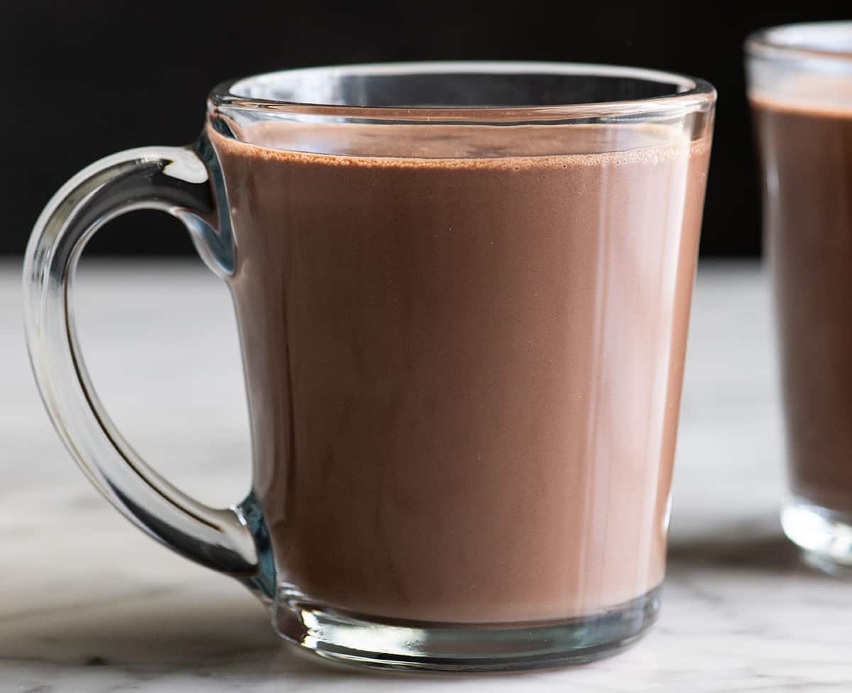 front view of a glass mug of homemade hot cocoa